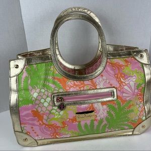 Lilly Pulitzer handbag in pinks & oranges with gold trim.